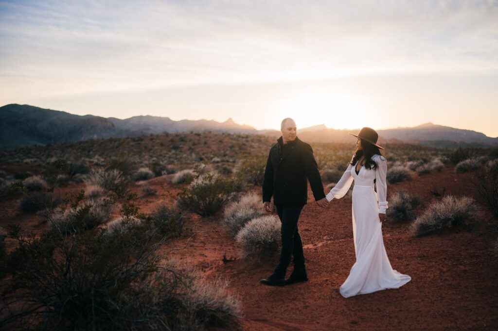 Lovely Couple walking around during sunset for their engagement photos at Valley of Fire State Park in Las Vegas.