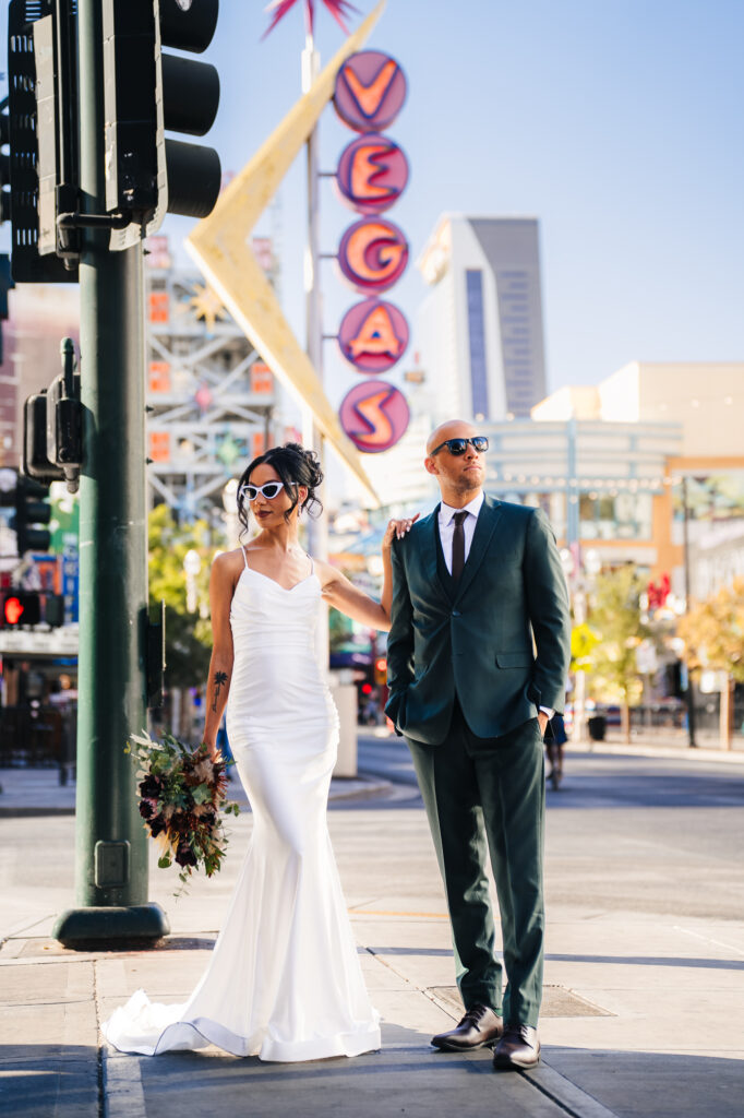 Newlywed couple walking around downtown Las Vegas.
