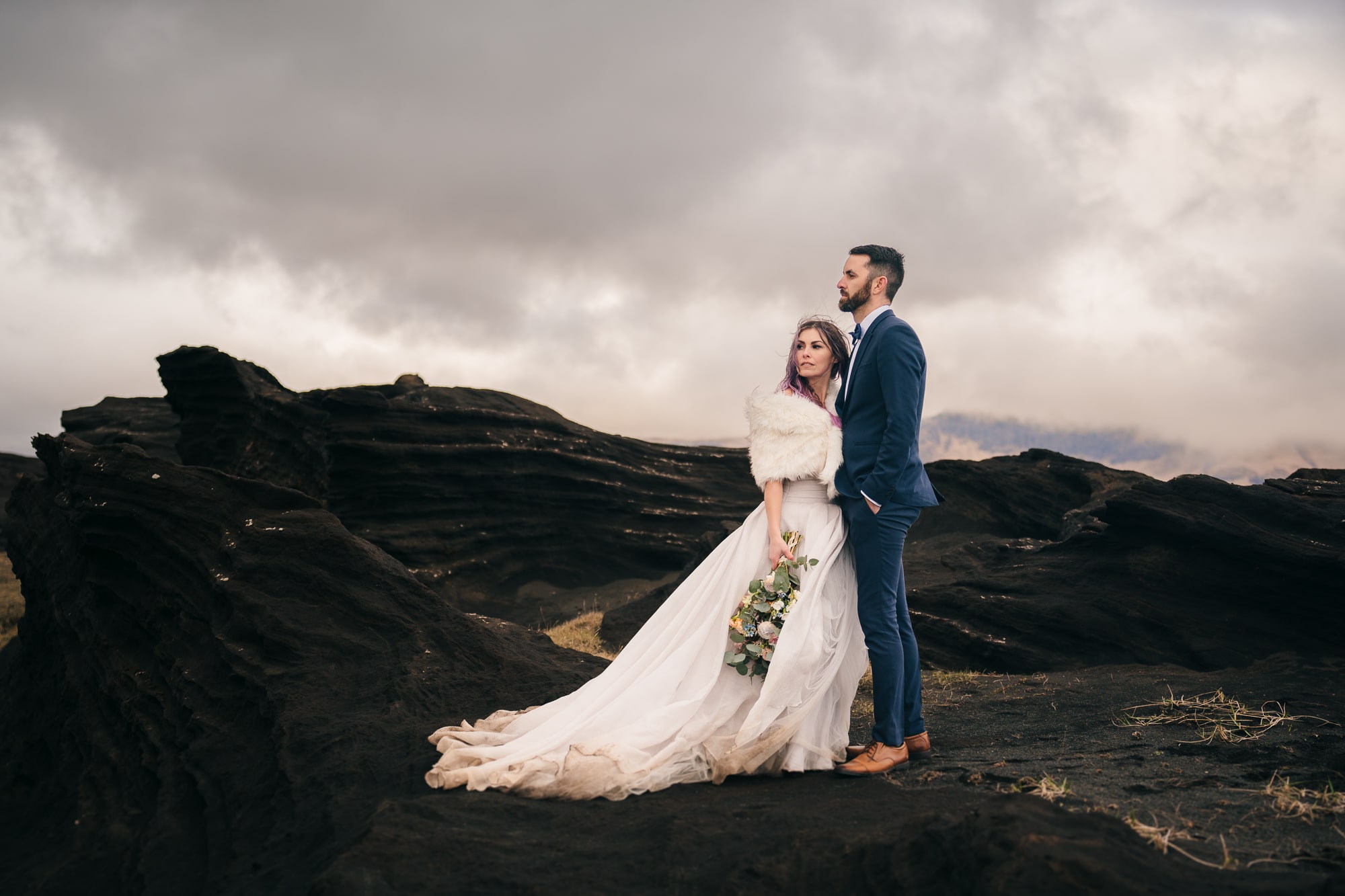 Elopement photo taken at an epic rock formation in Iceland