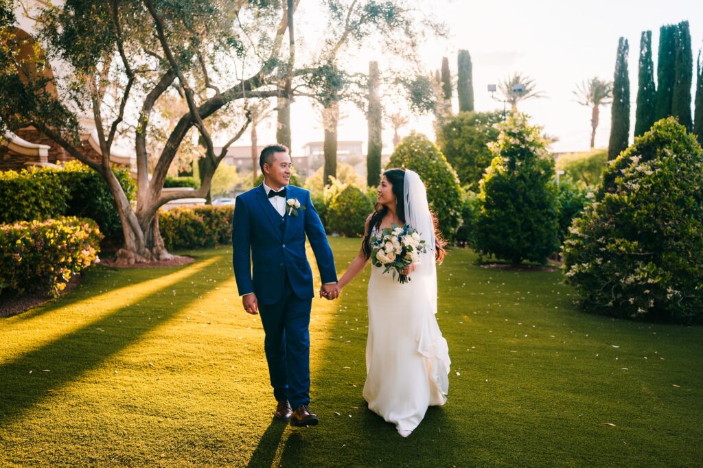 Newly wed couple enjoying a stroll at Green Valley Ranch during their cocktail hour.