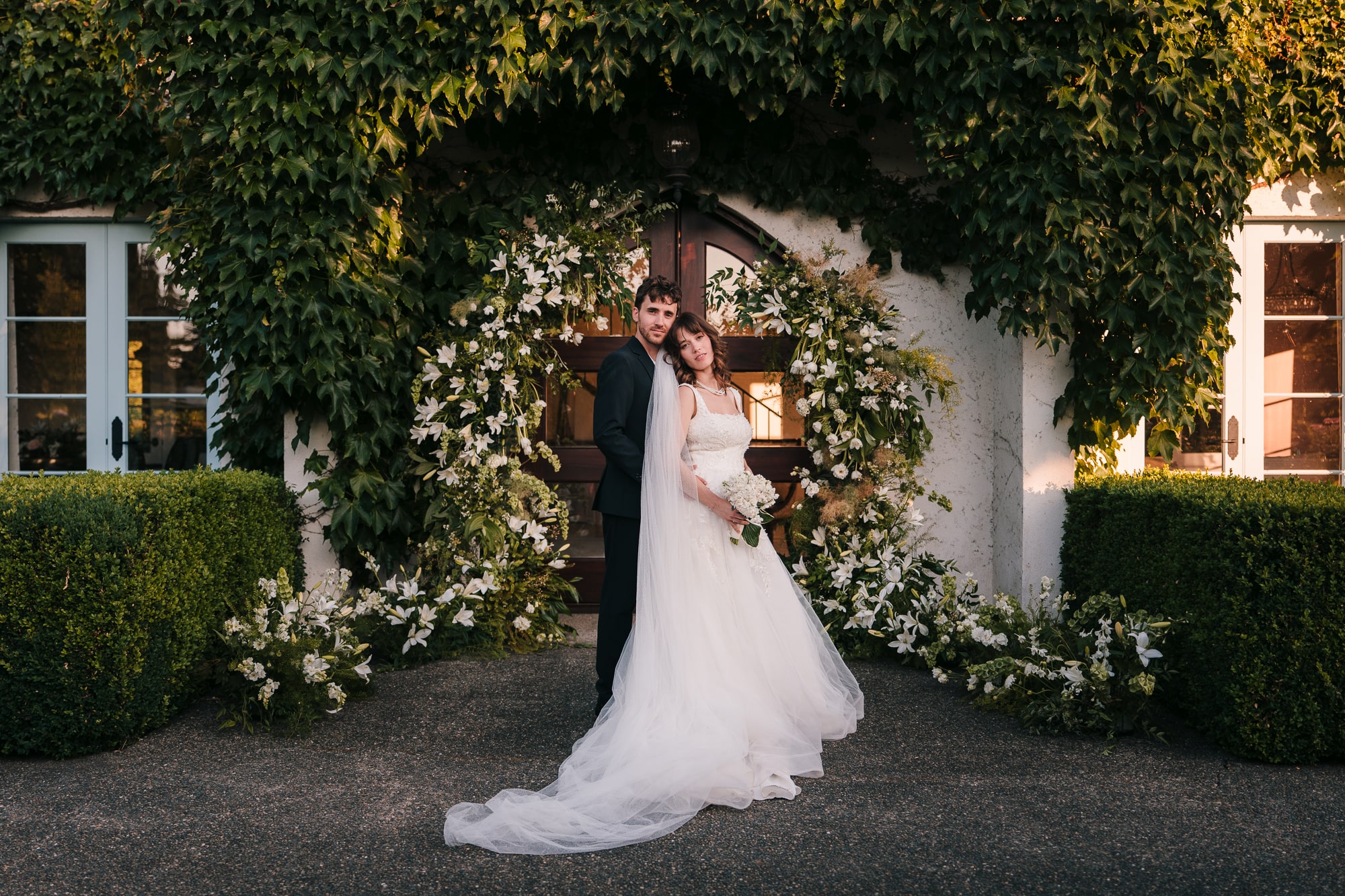 Couple sharing an intimate moment during their wedding at Monet Vineyards in Washington state.